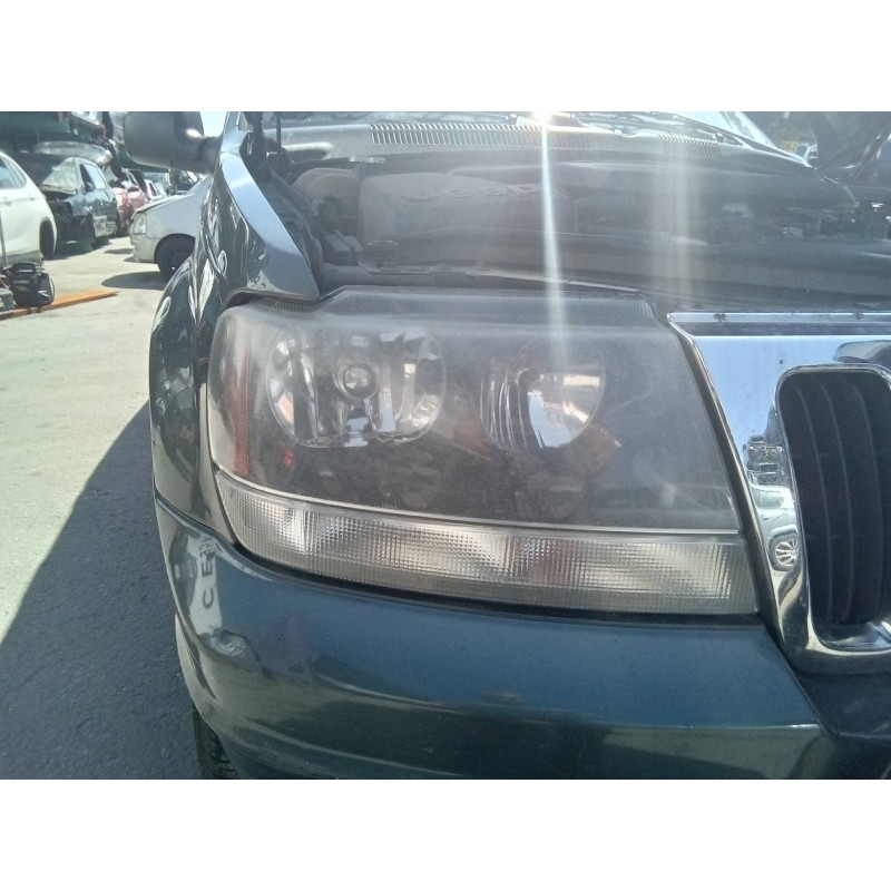 Recambio de faro derecho para jeep gr.cherokee (wj/wg) 2.7 crd laredo referencia OEM IAM 30987  