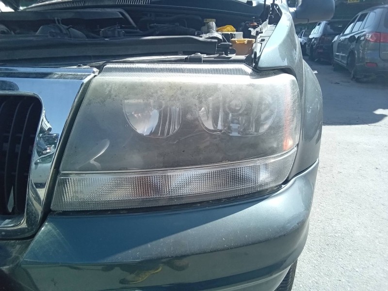 Recambio de faro izquierdo para jeep gr.cherokee (wj/wg) 2.7 crd laredo referencia OEM IAM 30987  