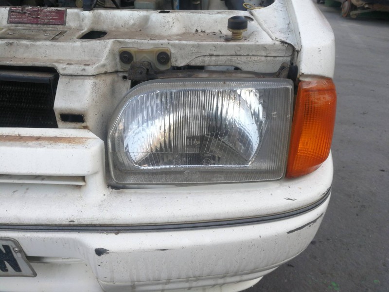 Recambio de faro izquierdo para ford escort berlina ghia referencia OEM IAM 34540R7  