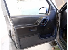Recambio de guarnecido puerta delantera izquierda para chrysler jeep gr.cherokee (wj/wg) 3.1 td laredo referencia OEM IAM   